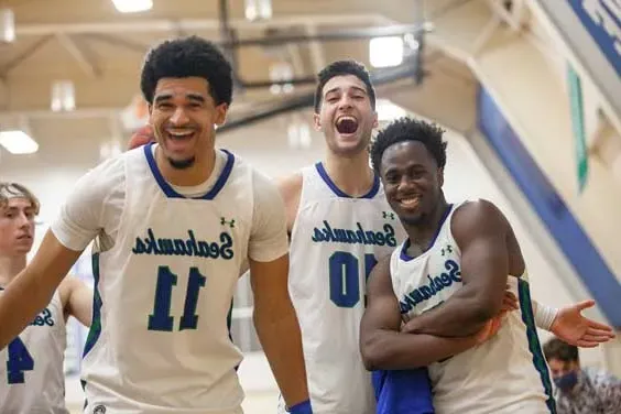 three mens basketball players